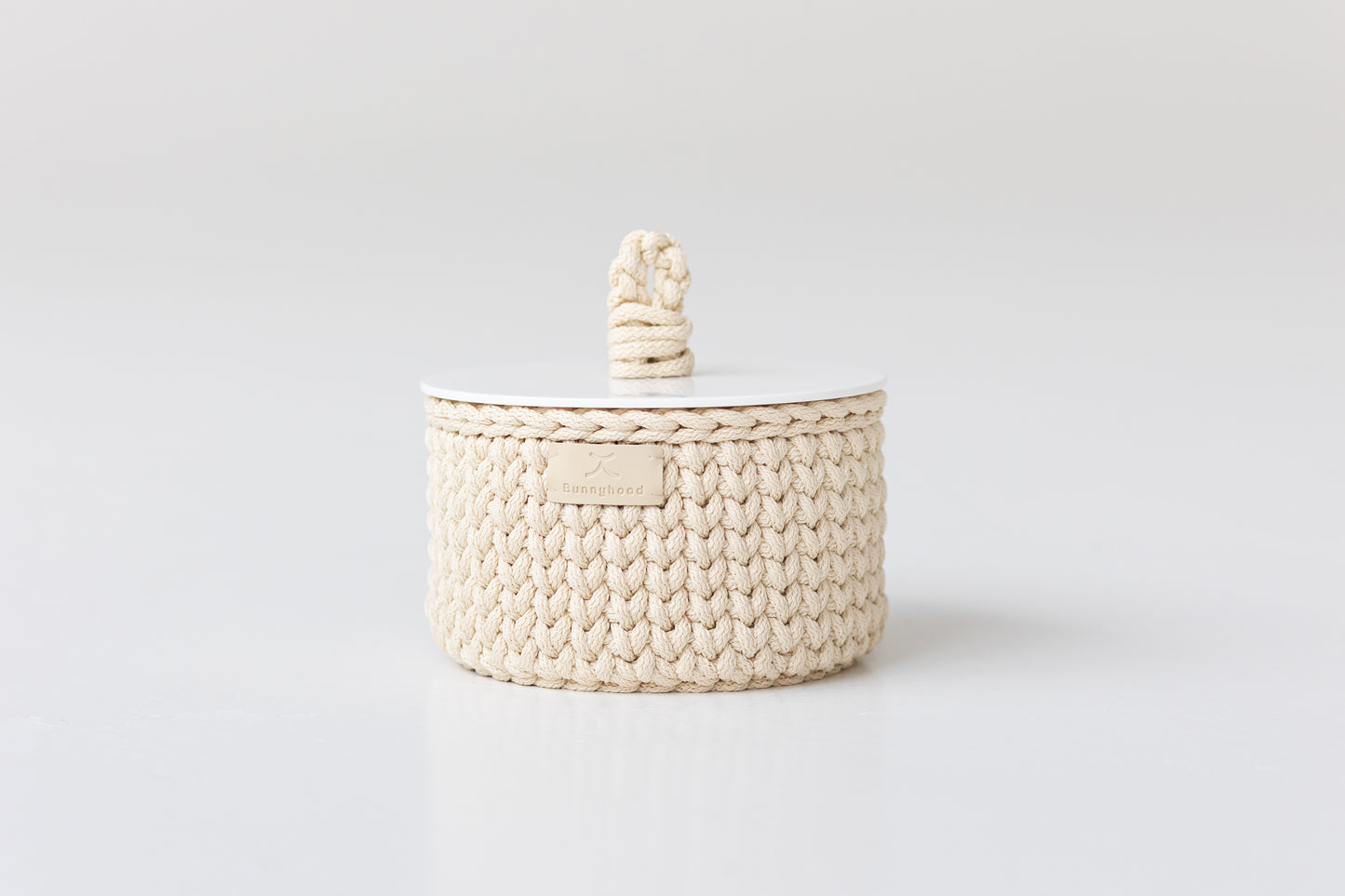 Woven basket with a lid